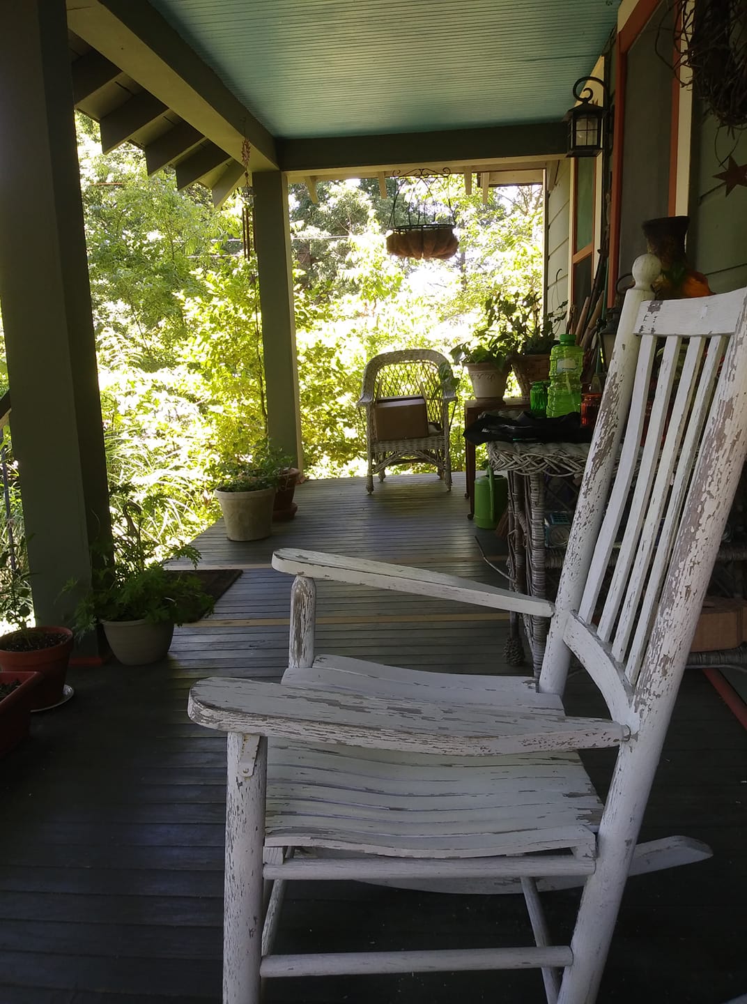 Blue porch with rocking chairs